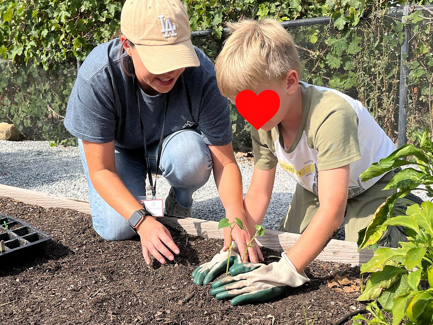 Farm to School Coordinator Alli Villegas assists Casa Pacifica Youth with Gardening