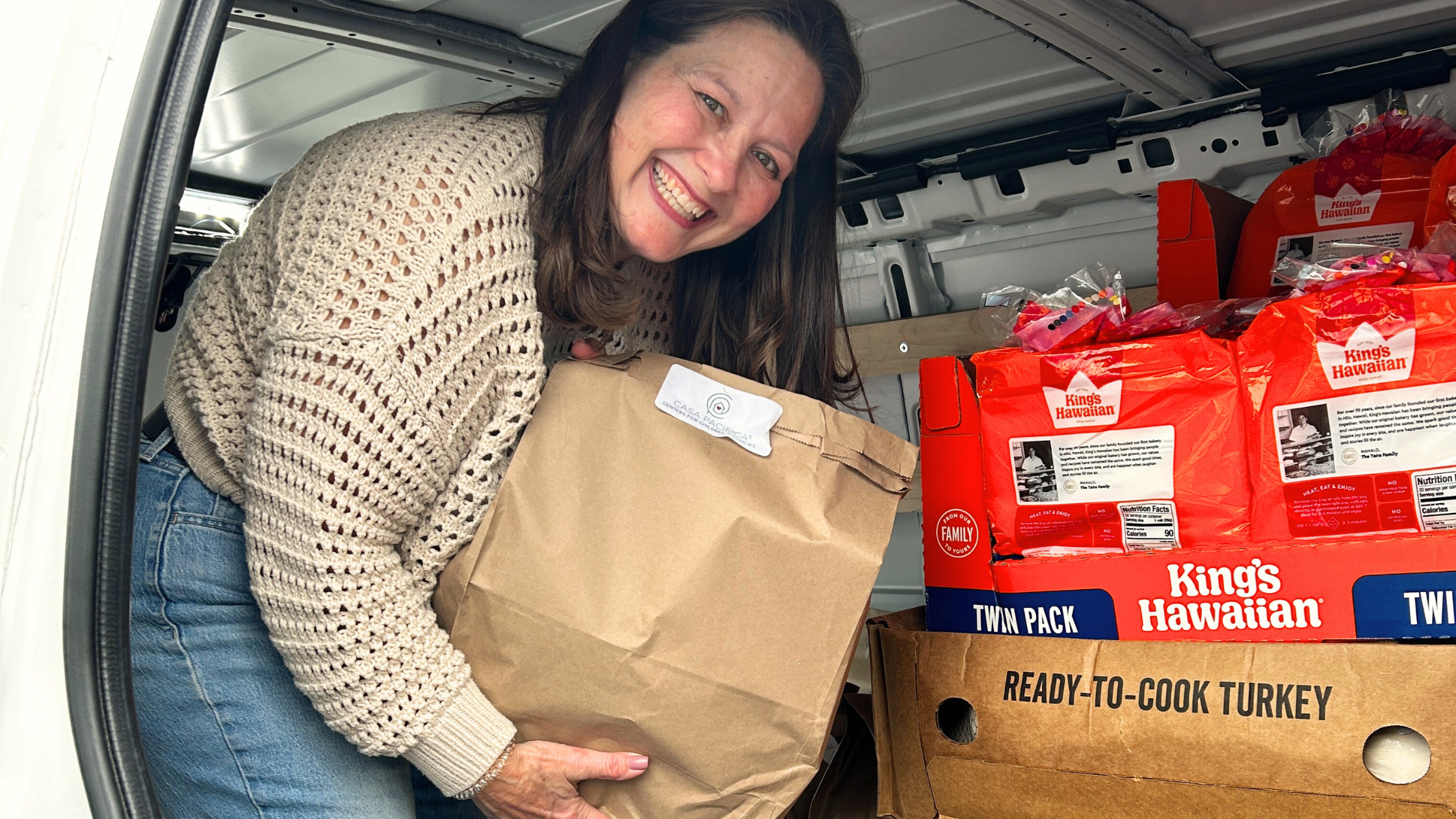 Woman holding thanksgiving family meal bag